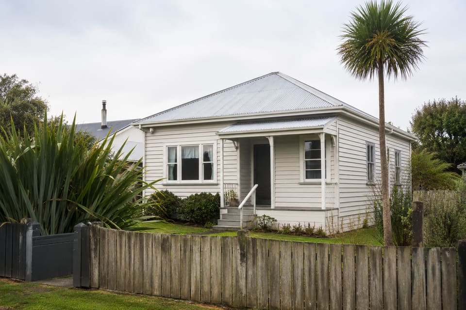 A well-kept timber weatherboard home on a New Zealand suburban section